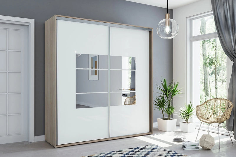 Szafa do sypialni z białym frontem Apollo 2-2 w stylowej sypialni z pięknym fotelem