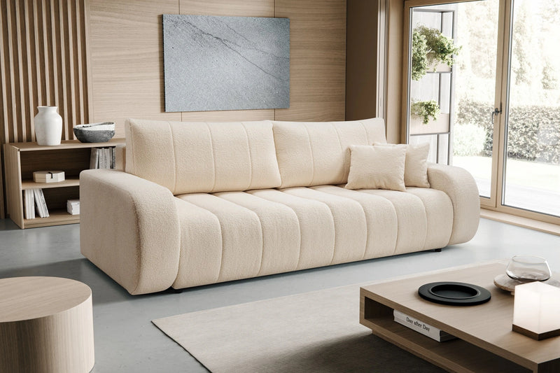 Modna,  beżowa sofa w nowoczesnym salnie