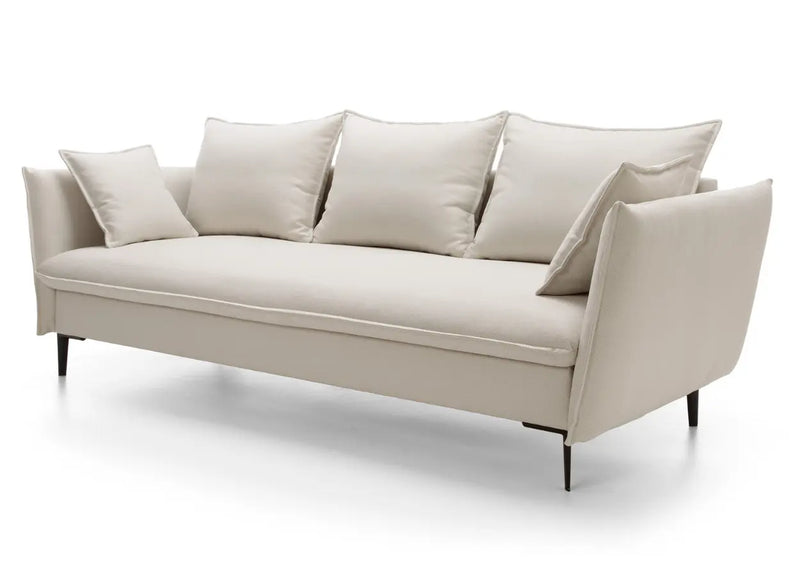 Kremowa sofa z poduszkami i funkcją spania