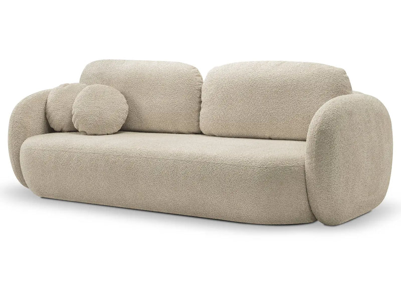 Jasno beżowa sofa z okrągłą poduszką i boczkami