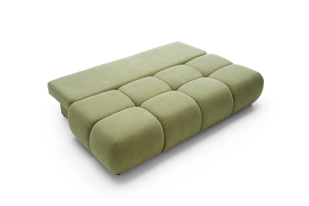 Rozłożona sofa w kolorze zielonym
