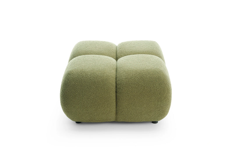 Zielona pufa w tkaninie boucle