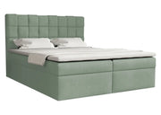 Pistacjowe łóżko kontynentalne z modnym, plecionym wezgłowiem 