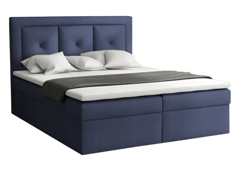 Granatowe, pikowane łóżko do sypialni