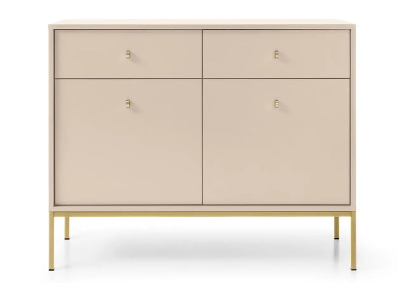 Mała komoda w kolorze beżowym ze złotymi uchwytami i złotymi nogami