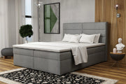 Szare łóżko do sypialni Passione box w jasnej aranżacji
