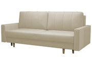 Kremowa sofa z poduszkami i możliwością rozłożenia